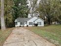 Cozy ranch home with a paved driveway, situated on a wooded lot at 5003 Aberdun Ct, Charlotte, NC 28215