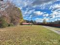 Property view showing home, yard, and surrounding landscape at 133 Elmwood Rd, Statesville, NC 28625