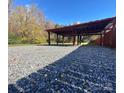 Covered gravel shooting range with wooden supports at 133 Elmwood Rd, Statesville, NC 28625