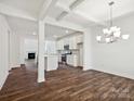 Open concept dining room with kitchen views and hardwood floors at 1050 Bull Dog Ln, Wingate, NC 28174