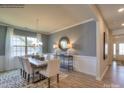 Elegant dining room featuring hardwood floors and neutral decor at 143 Dogwood Grove Pl, Troutman, NC 28166