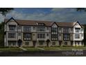 Modern three-story townhome building with white and gray exterior at 357 Jetton St, Davidson, NC 28036
