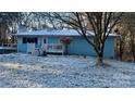 Ranch home covered in snow with white porch and landscaping at 3031 Davidson Hwy, Concord, NC 28027