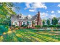 Landscaped lawn and brick home exterior at 3703 Margaret Wallace Rd, Matthews, NC 28105