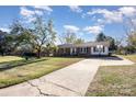 Brick ranch home with driveway, basketball goal, and yard at 319 Circleview Dr, Shelby, NC 28150