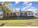 Brick ranch home with landscaped lawn, basketball goal, and walkway at 319 Circleview Dr, Shelby, NC 28150