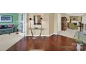 Hardwood floors, glass-top table, and views into living room and other rooms at 4022 Blackburn Ct, Fort Mill, SC 29707