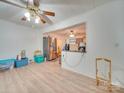 Bright dining area with wood flooring and kitchen views at 504 N Pine Ln, Wadesboro, NC 28170