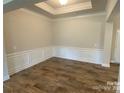 Formal dining area with wainscoting and hardwood floors at 401 Imperial Way # 25, Albemarle, NC 28001