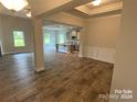 Open floor plan connects dining and kitchen areas with hardwood floors at 401 Imperial Way # 25, Albemarle, NC 28001