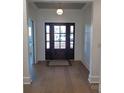 Light and airy entryway with hardwood floors and a view into a home office at 405 19Th Ave Nw Cir, Hickory, NC 28601