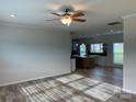 Open concept living room with a view into the kitchen at 568 Drumstand Rd, Stony Point, NC 28678