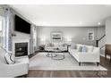 Spacious living room with fireplace and neutral color palette at 7315 Childress Sw Dr, Concord, NC 28025