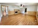 Spacious living room featuring hardwood floors and a fireplace at 142 Swink Sw St, Concord, NC 28027
