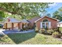 Brick ranch house with landscaped yard, covered carport, and walkway at 1811 Charter Dr, Rock Hill, SC 29732