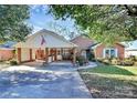 Brick ranch house with landscaped yard, covered carport, and walkway at 1811 Charter Dr, Rock Hill, SC 29732