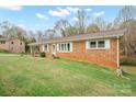 Brick ranch house with a large front yard at 221 4Th Ne St, Conover, NC 28613