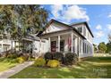 Two story craftsman home with a covered front porch and American Flag at 511 E Main St, Rock Hill, SC 29730