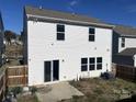 View of the home's back, showing a patio and fenced yard at 533 Copes Ct, Kannapolis, NC 28081