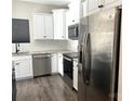 Modern kitchen with stainless steel appliances and granite countertops at 533 Copes Ct, Kannapolis, NC 28081