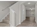 Entryway with carpeted stairs leading to the second floor at 3128 Mcgee Hill Dr, Charlotte, NC 28216