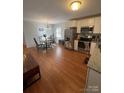 Eat-in kitchen with white cabinets and stainless steel appliances at 48844 Hidden Rd, Norwood, NC 28128