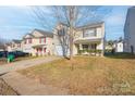 Two story house on a tree lined street with other similar homes at 5137 Grays Ridge Dr, Charlotte, NC 28269