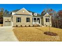 Two-story home with a side entry garage and landscaping at 3850 Willow Grove Ln # 24, Concord, NC 28025