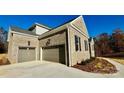 Two-car attached garage with gray doors at 3850 Willow Grove Ln # 24, Concord, NC 28025