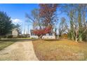 House exterior showcasing a driveway and autumn foliage at 2328 Danforth Ln, Charlotte, NC 28208