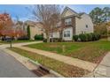 Two-story home with partial brick exterior and driveway at 7108 Kinley Commons Ln, Charlotte, NC 28278