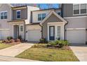 Modern townhome community with attached garages and well-maintained landscaping at 9232 Widden Way, Charlotte, NC 28269
