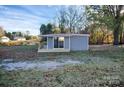 Gray sided home with a deck and large backyard at 1406 Todd Ave, Kannapolis, NC 28081