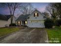 Virtually staged exterior of a charming one-story home with a two-car garage at 2705 Towhee Ct, Charlotte, NC 28269