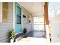 Quaint front porch with light gray siding and blue door at 520 13Th Sw St, Hickory, NC 28602