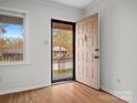 Interior entryway with wood floors and view to front porch at 124 Ashleigh Ct, Fort Mill, SC 29715