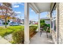 Covered porch with seating area overlooking the neighborhood at 12816 Cumberland Cove Dr, Charlotte, NC 28273