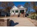 Well-maintained house with a driveway and landscaping at 1721 Pegram St, Charlotte, NC 28205