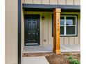 Inviting front entrance with a wood post and brick walkway at 3012 Isle Ln, Monroe, NC 28110