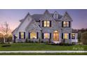 Two-story house with stone accents and a three-car garage at Lot 41 Rivermist Dr # Devonshire, Belmont, NC 28012