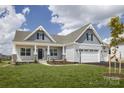 One-story house with gray siding, white trim, and a two-car garage at Lot 51 Watercourse Way # Arcadia, Belmont, NC 28012