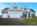 Two-story house with light beige vinyl siding and a two-car garage at Lot 51 Watercourse Way # Arcadia, Belmont, NC 28012