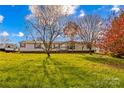 Single-wide manufactured home with a large yard and RV parking at 227 Grassy Meadow Ln, Statesville, NC 28625