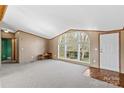 Bright living room with large window and parquet flooring at 227 Grassy Meadow Ln, Statesville, NC 28625