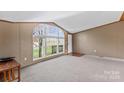 Spacious living room featuring a large arched window at 227 Grassy Meadow Ln, Statesville, NC 28625