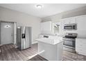 Modern kitchen with white cabinets, stainless steel appliances, and an island at 3332 York Hwy, Gastonia, NC 28052