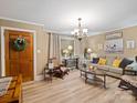 Cozy living room with hardwood floors, sofa, and rocking chair at 4356 Charles Raper Jonas Hwy, Alexis, NC 28006