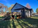Gray house with a wooden deck and stairs leading to the yard at 4541 Hall Dairy Rd, Claremont, NC 28610