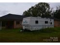 Travel trailer parked beside brick home at 596 Armory St, Chester, SC 29706