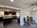 Open dining area with view of the kitchen at 701 Firecrest Se St, Concord, NC 28025